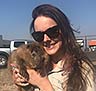 DWR Biologist Heather Talley holding a young beaver