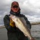 Angler holding a large walleye fish